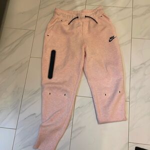 New- never worn. Nike sized Medium track pants